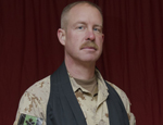 Captain the Reverend Howard Rittenhouse, Padre of the 3rd Battalion, Princess Patricia’s Canadian Light Infantry, and Task Force Chaplain of the Canadian Contribution to the Training Mission in Afghanistan, adds a black liturgical scarf to his normal dress of arid-pattern CADPAT in preparation to conduct a service.
