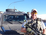 Staff Sgt. Kelsall poses in front of his vehicle near Bamyan.