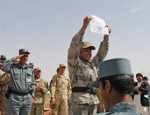 A new Afghan Border Policeman displays his certificate at a graduation ceremony in Spin Boldak, Afghanistan, for 300 new Afghan Border Police and Afghan Uniformed Police. Credit: Spc. Scott D. Matheson, U.S. Army