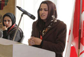 Afghan woman speaking during International Women's Day