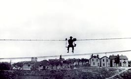 An electrician balanced on a high-wire, 1916.