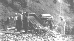 Railway workers dumping
 truckloads of debris