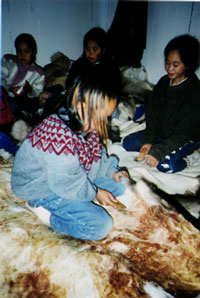 Students Scraping Caribou Hide