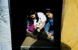 Students Scraping Caribou Hide