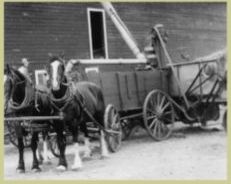 Picture of a wagon being filled with Grain