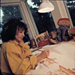 Photo: Ginette Anfousse at her drawing table