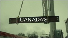 Still image, steel beam with the word “Canada’s” over it.