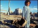 Image number 8: child holding a basket on a destroyed city background.