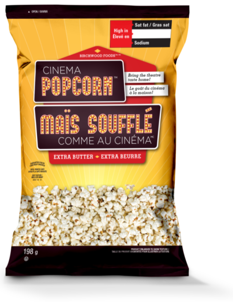 This is an image of the front panel of a bag of popcorn called Cinema Popcorn. In the top right corner is the red rectangle nutrition symbol without the Health Canada attribution indicating that the product is high in saturated fat and sodium. 