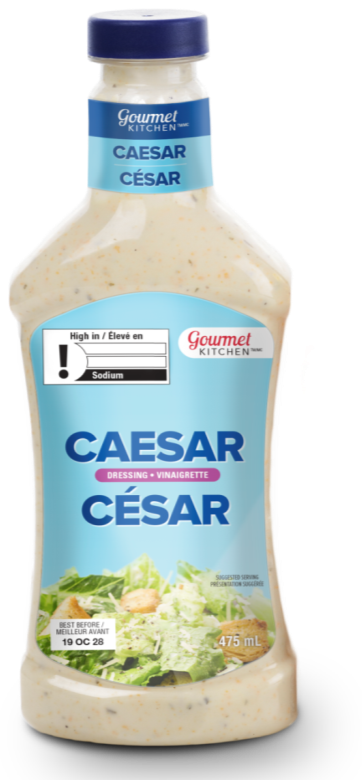 There is an image of the front panel of a bottle of Caesar salad dressing. In the top left corner is the exclamation point nutrition symbol without the Health Canada attribution indicating that the product is high in sodium. 