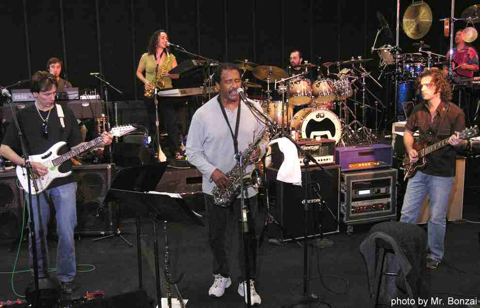 © Mr. Bonzai -- Pictured during rehearsals at Center Staging for the Zappa Plays Zappa tour are: (foreground L-R) Steve Vai, Napoleon Murphy Brock, and Dweezil Zappa.
(Rear L-R) Aaron Arntz, keyboard, vocals; Scheila Gonzales, horns, keyboards, vocals; Joe Travers, drums; Billy Hulting, melodic percussion.

