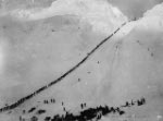 Photograph: Miners and prospectors ascending summit of Chilkoot Pass.