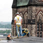 Two construction workers work on the roof of the Southeast Tower, West Block