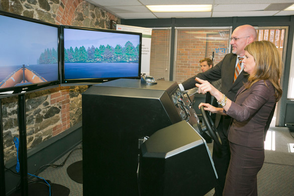 Two people participating in a demonstration at Virtual Marine Technology