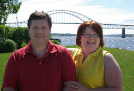 Sandra Dowling and her husband, Louis, at the iconic Miramichi Bridge