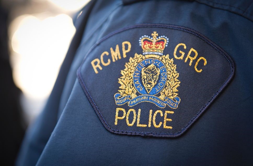 An RCMP shoulder badge with a crest.