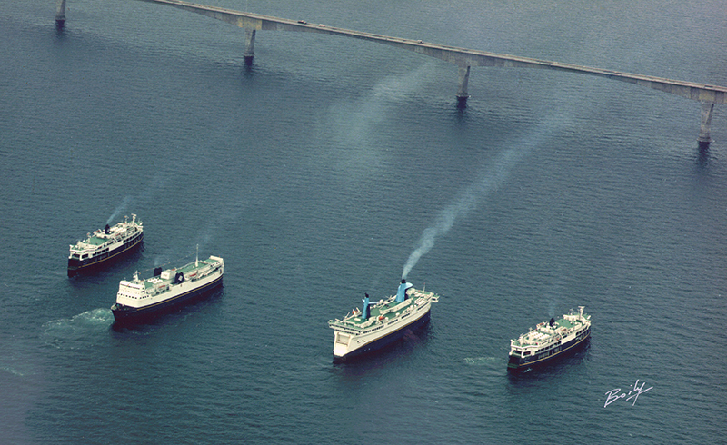 Aerial photo of large vessels having passed under the Confederation Bridge