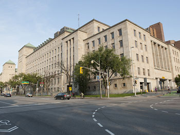 A front view of the West Memorial Building on the corner of Wellington Street (front of the building) and Bay Street (west side of the building)