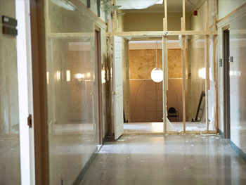 A view of a hallway in the West Memorial Building leading to unfinished construction/deconstruction work