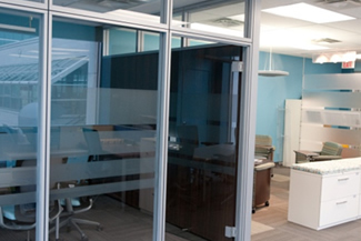 Boardroom with glass demountable wall system is a sustainable choice and allows more natural light to enter into the boardroom, Ottawa, ON