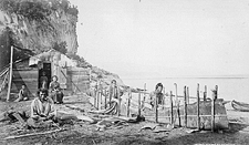 Montagnais People making a bark canoe, Murray Bay (Pointe-au-Pic), Quebec, ca. 1863. Photographer: Alexander Henderson. Library and Archives Canada, PA-149709