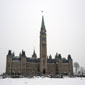 The Governor General's flag floats above the Peace Tower on a snow covered Hill