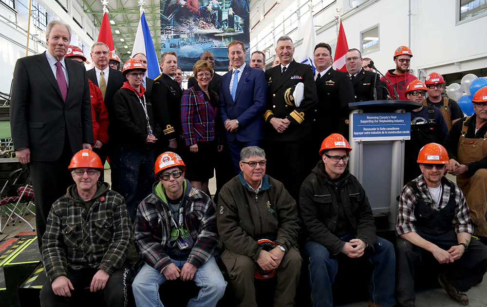 A group of women and men posing for a photo.