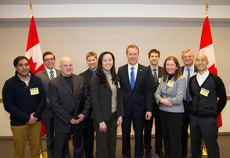 A group of men and women posing for a photo.