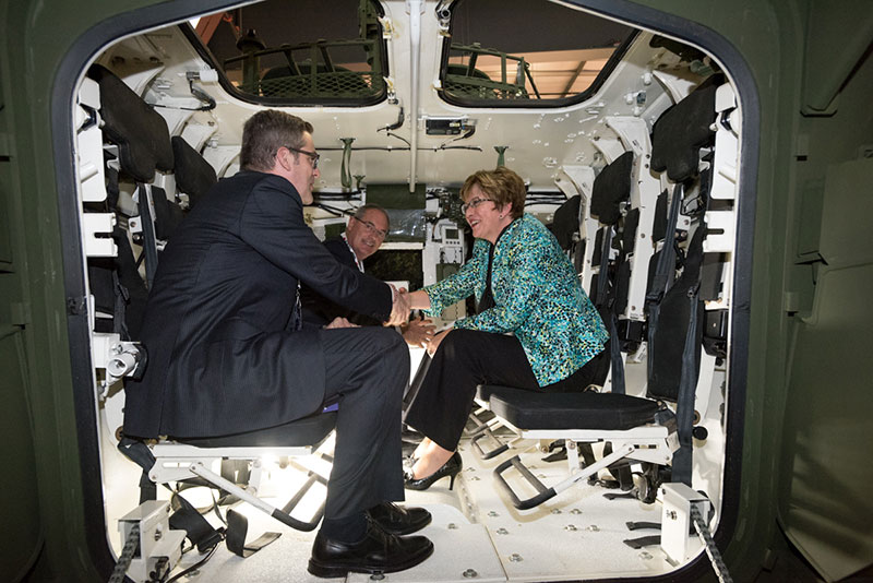 A man shaking a women’s hand.