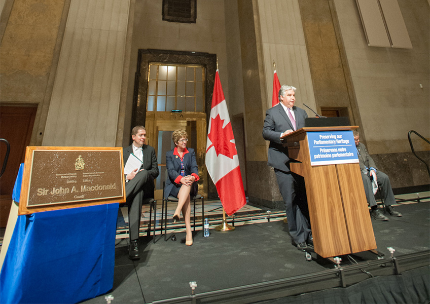 Man standing behind a podium.