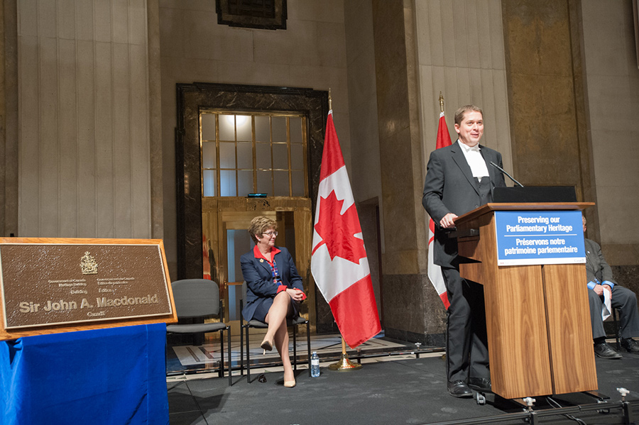 Man standing behind a podium.