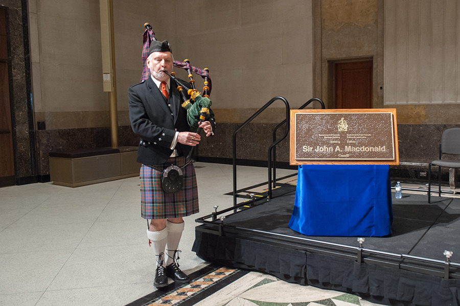 A man playing bagpipes.