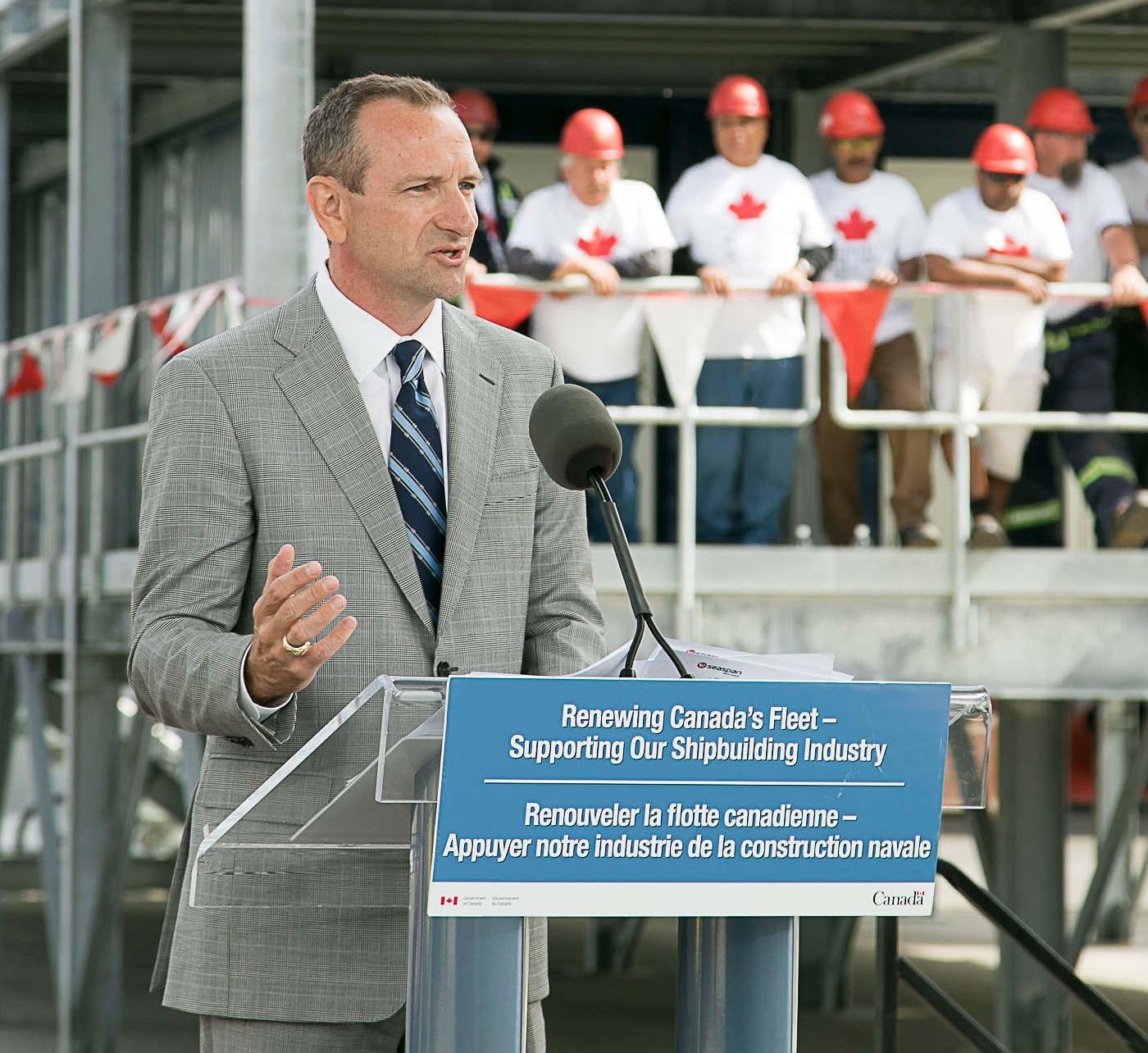 Man standing behind a podium.