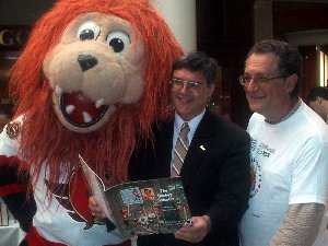 From left to right: Sparticat, Alex Cullen, Community Councillor, Bay Ward, Ottawa, Ronald Cohen, President, Friends of the National Library of Canada.