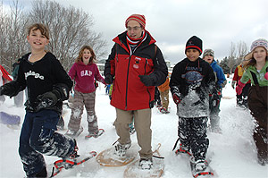 Health Minister Tony Clement launches WinterActive 2008 by 
competing in a snowshoe relay race at Deerhurst Resort with students 
from Pine Glen Public School.