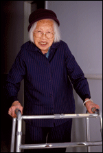 A senior woman using a walker