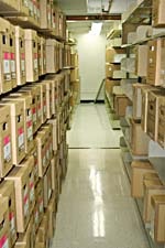 Photograph showing boxes of archival documents