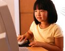 Girl reading a computer screen