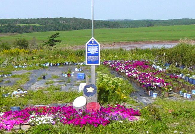 Colchester County: Acadian Heritage sign #24, Farmer Clem's Garden Center, Stewiacke