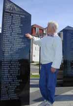 Blue Rocks resident Sheevaun Nelson studies the names engraved on the Lunenburg Fishermen's Memorial. The monument's 1996 unveiling inspired her to begin a web site of the names of lost fishermen.