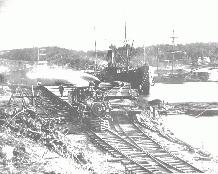Nova Scotia: Unloading rails in Bridgewater in 1904