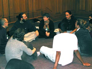 Participants sitting in circle sharing ideas