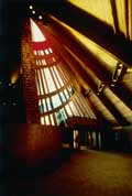 Precious Blood Church - View of entrance, stained glass window and baptismal font