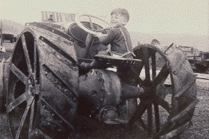 Early tractor and young driver, photo courtesy of Gayle Trivers