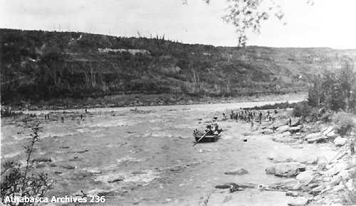 150 men taking steamer boiler through Grand Rapids.