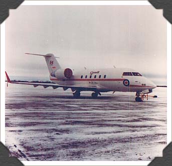 Quartering frontal view- RCAF Challenger parked on snowy tarmac