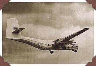 RCAF Caribou in flight, gear & flaps down