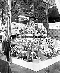 Carl Grossman standing with Chilliwack Exhibit at early Vancouver Fair. P897.