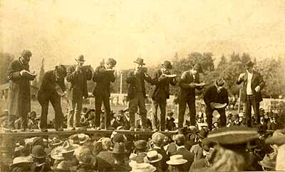 Prominent Chilliwack citizens having a watermelon eating contest at the Chilliwack fair. P.Coll 71, file 3.