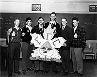 Newly elected executive of the Future Farmers of Canada pose with their group crest. 1997.11